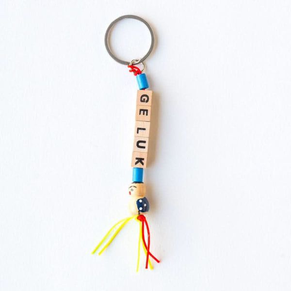 Porte-clés poupée porte-bonheur