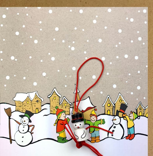 Fabrication de cartes de Noël en papier kraft avec un bonhomme de neige