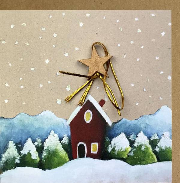 Carte de Noël en papier kraft avec une maison